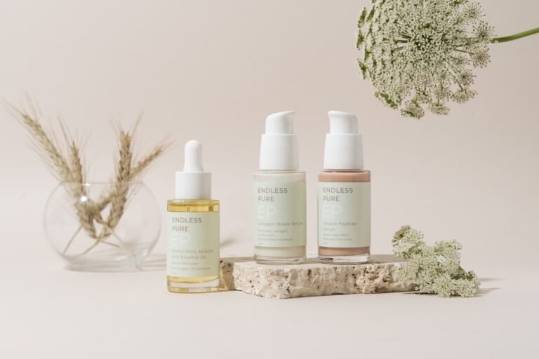 A serene bathroom countertop with skincare products, including cleansers, moisturizers, and serums, arranged neatly. Natural light illuminates the scene, highlighting the textures of the products.