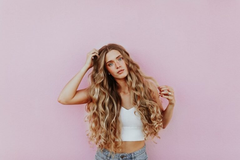 A close-up of smooth, shiny hair with a soft focus background, showcasing healthy hair texture.