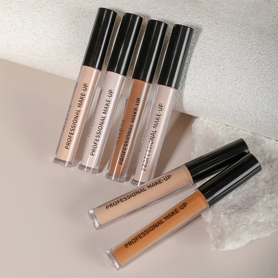 Matte liquid concealer tube with applicator and swatch on skin – view 3
