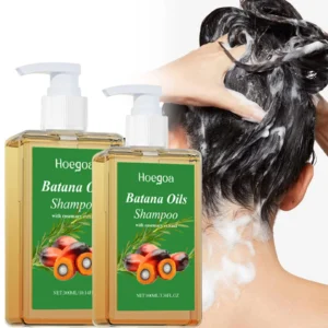 Bottle of Organic Batana Oil Shampoo with Rosemary on white background, front label visible