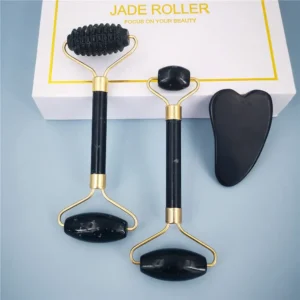 Jade roller and gua sha set with copper frame on a neutral background