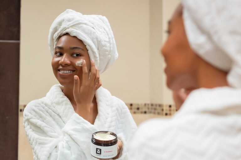 A serene bathroom setting with skincare products like moisturizers and serums on a countertop, surrounded by soft towels and natural light.